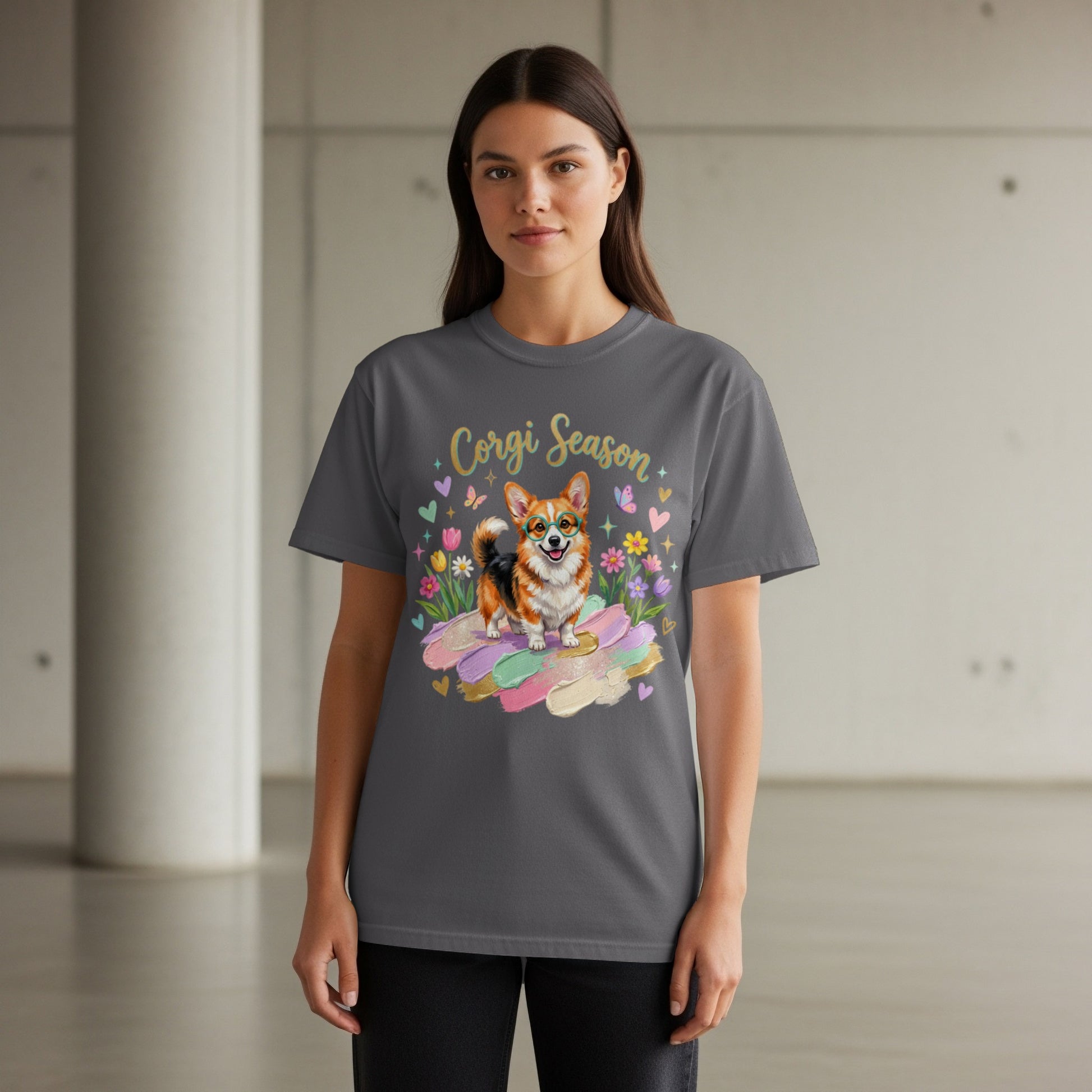 Woman wearing a grey t-shirt with a corgi and "Corgi Season" text.