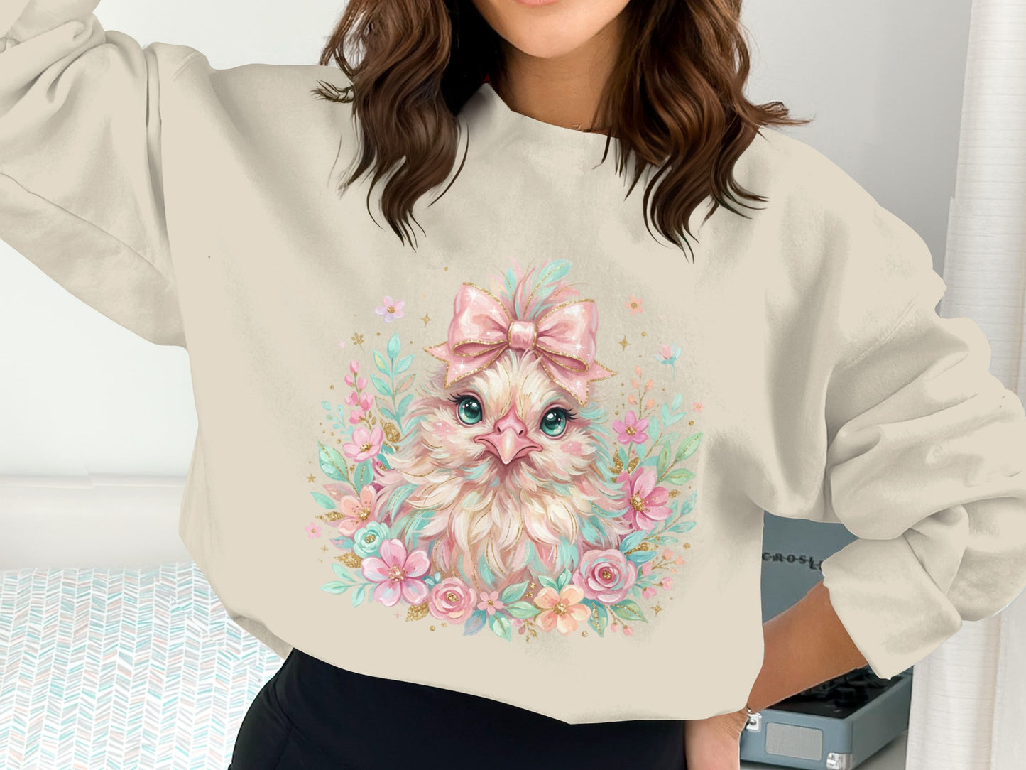 Crewneck sweatshirt with a cute baby chick graphic and floral accents.