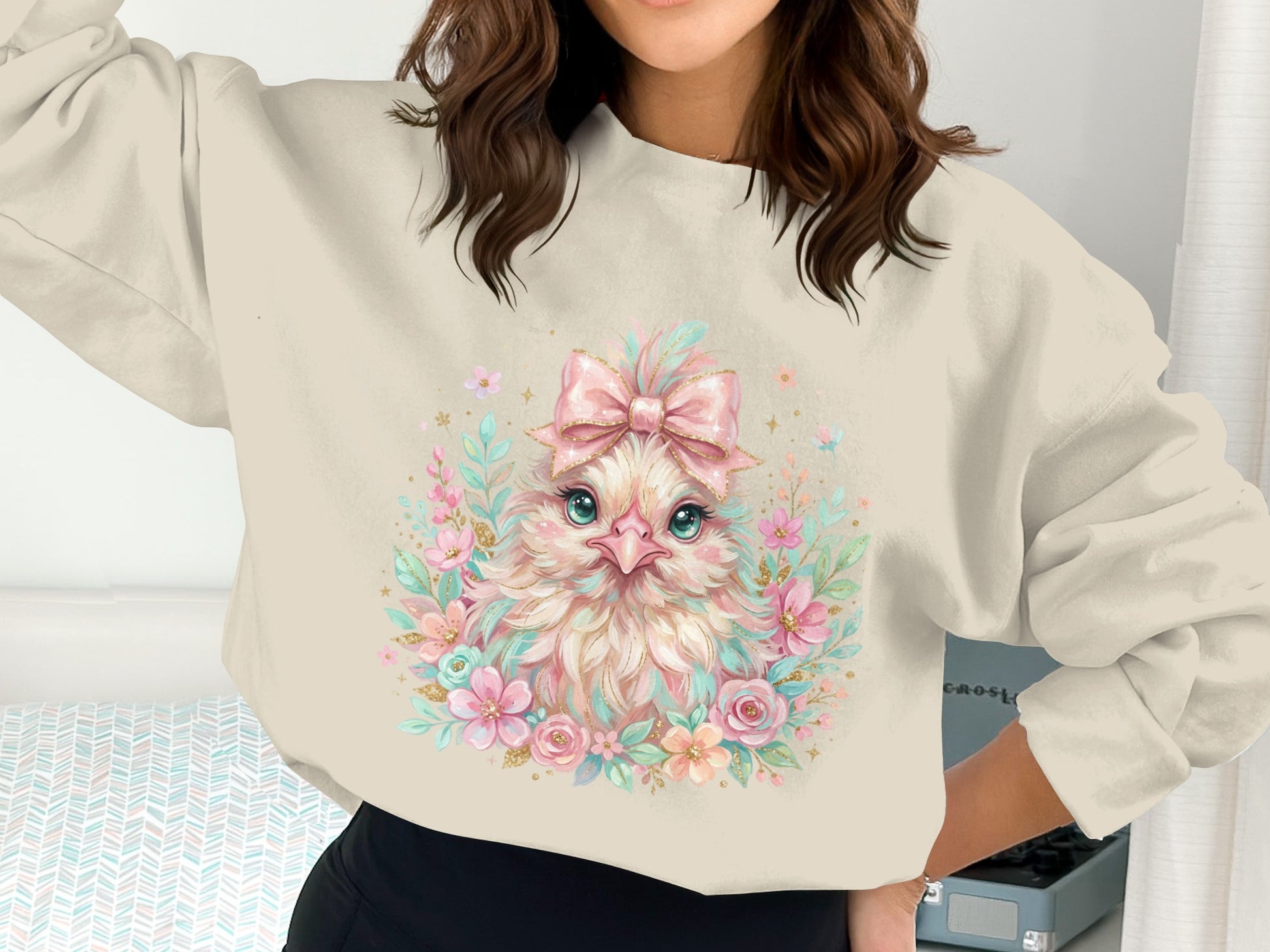 Crewneck sweatshirt with a cute baby chick graphic and floral accents.