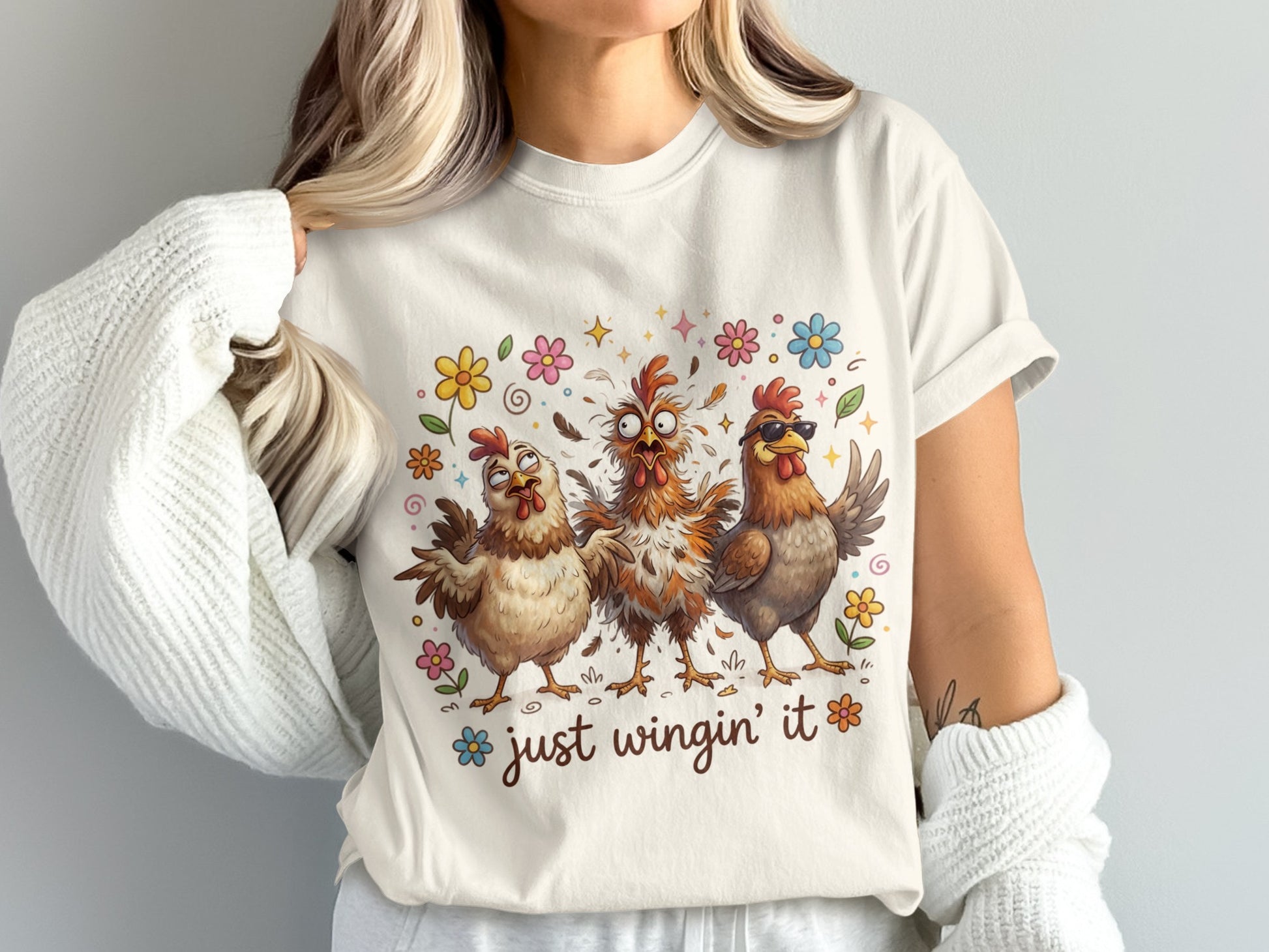 Three cartoon chickens with sunglasses and flowers, text "just wingin' it".