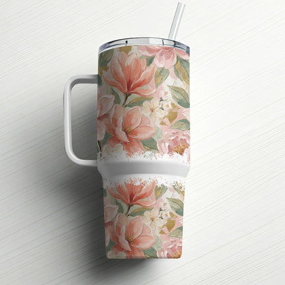 Tall tumbler with handle and straw, featuring a floral pattern of pink magnolias and green leaves.