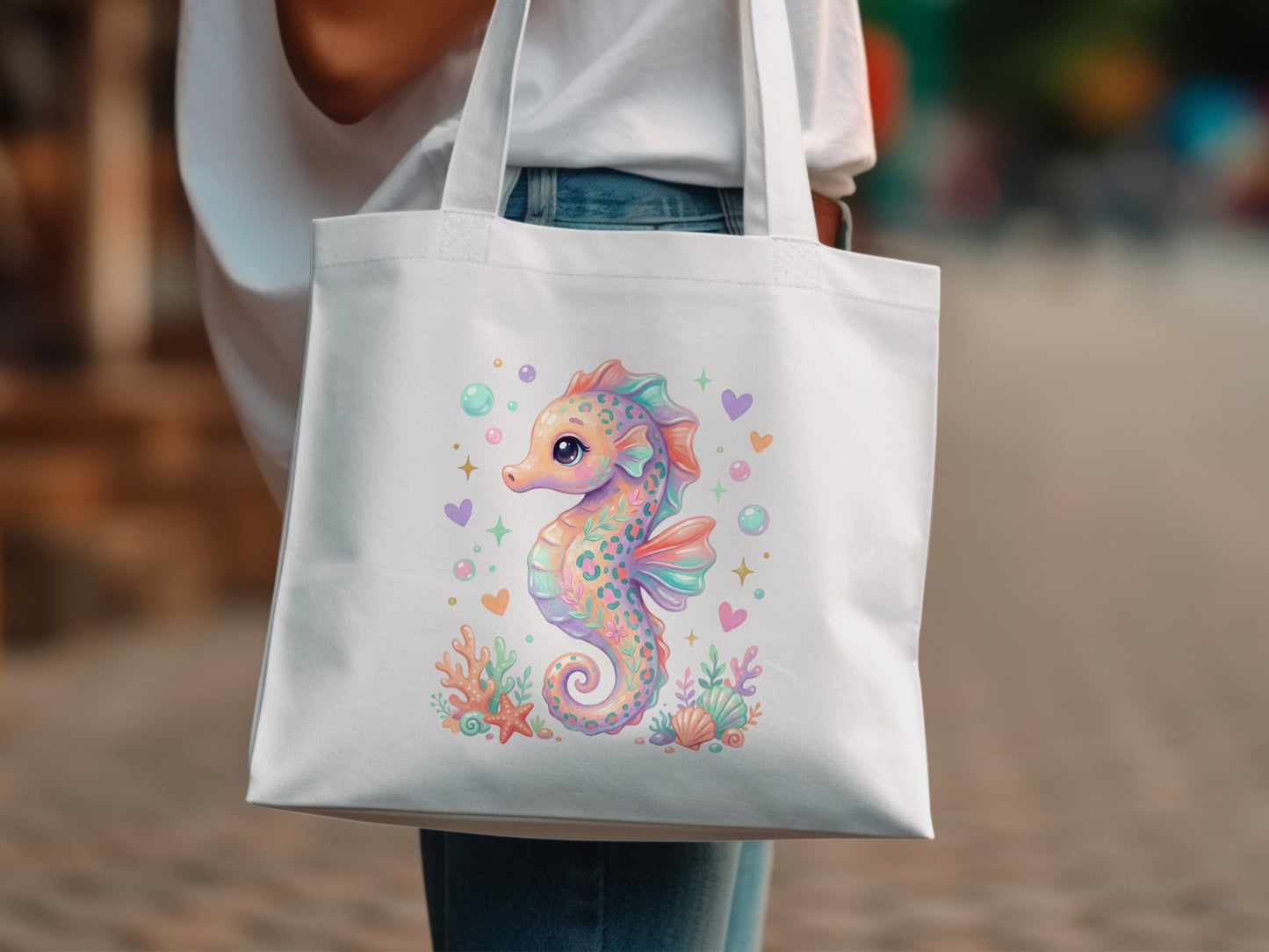 Tote bag with a whimsical pastel seahorse, coral, and bubbles design.
