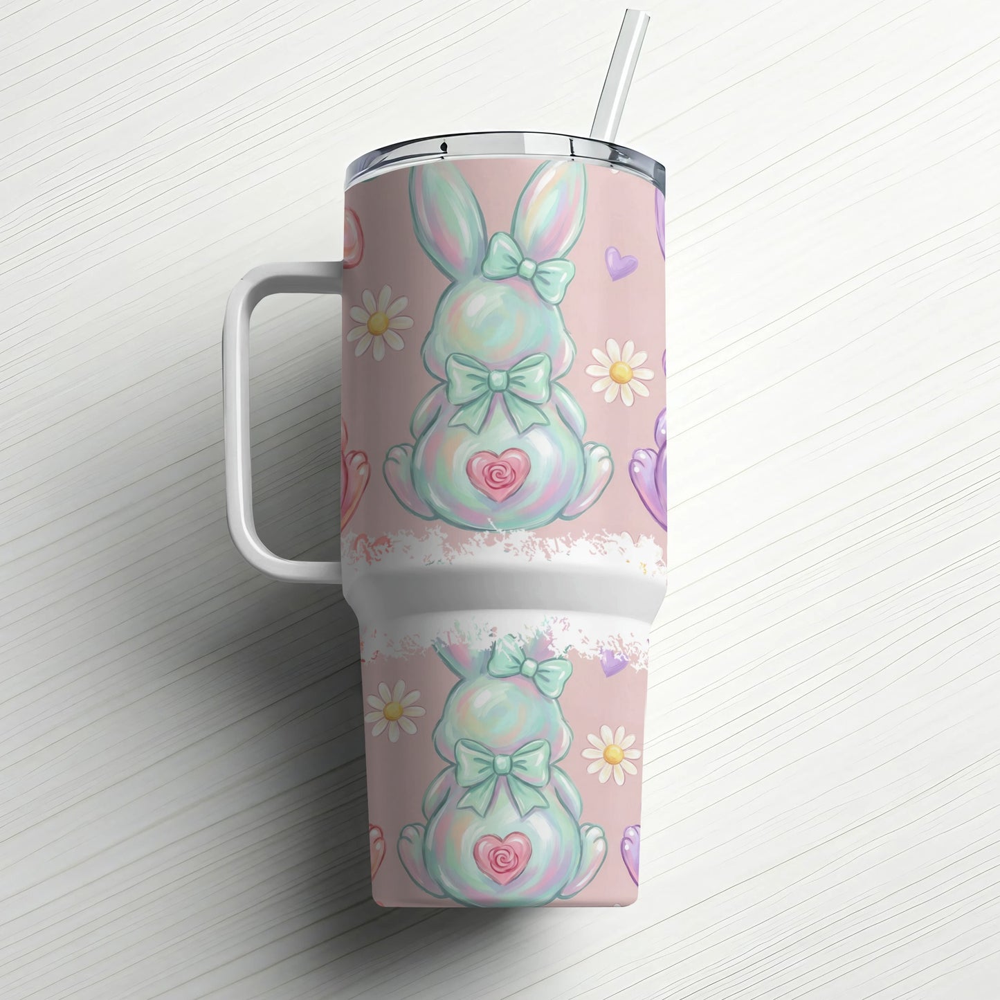 Easter bunny tumbler with straw and pastel floral pattern.
