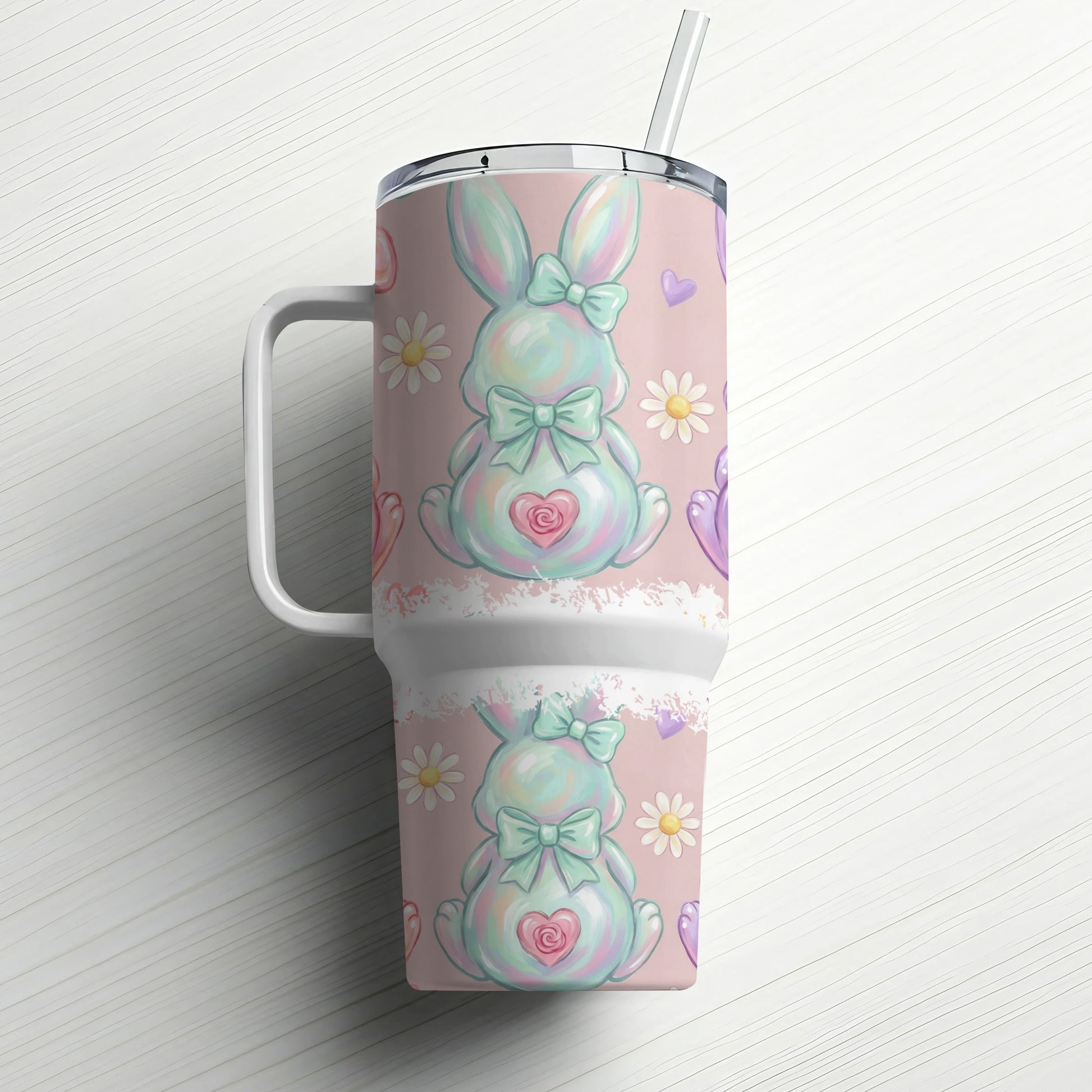 Easter bunny tumbler with straw and pastel floral pattern.