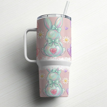 Easter bunny tumbler with straw and pastel floral pattern.
