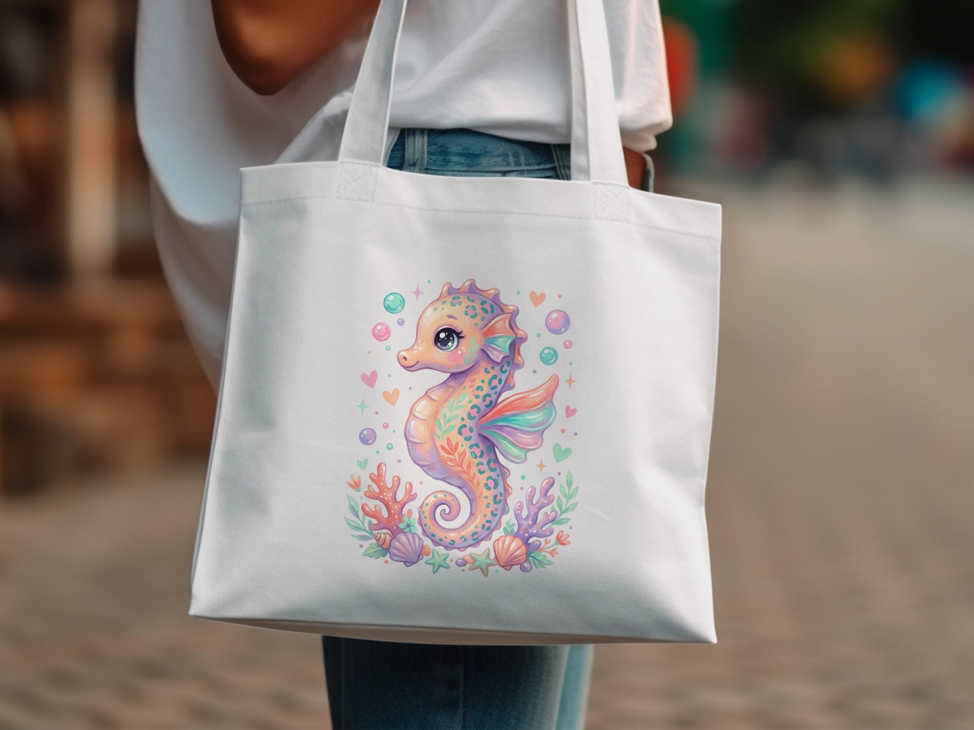 White tote bag with a colorful illustration of a seahorse and underwater elements.