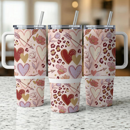 Three tumblers with Valentine's Day hearts and arrows pattern.