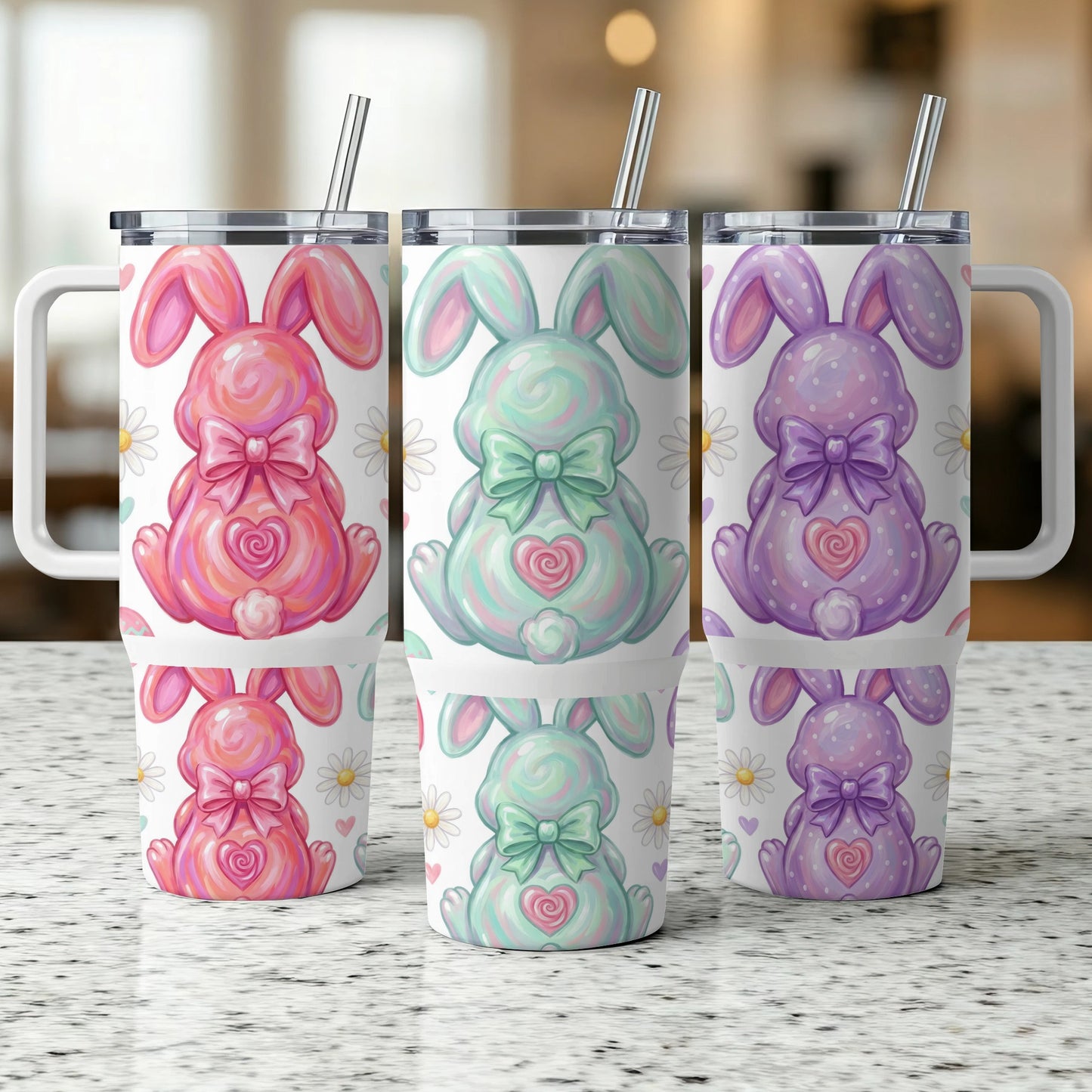 Three Easter bunny tumblers with pastel colors and daisy patterns.