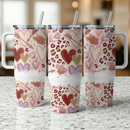 Three tumblers with heart and floral leopard print design.