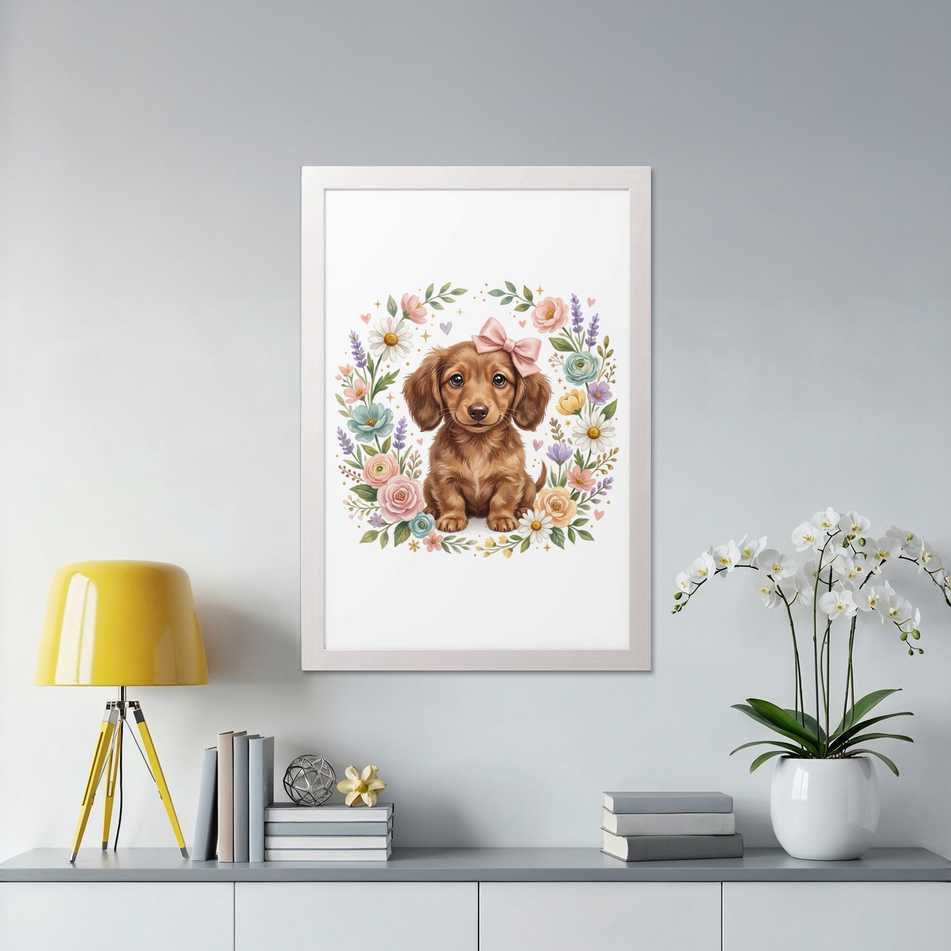 Brown dachshund puppy wearing a pink bow, surrounded by a floral wreath.