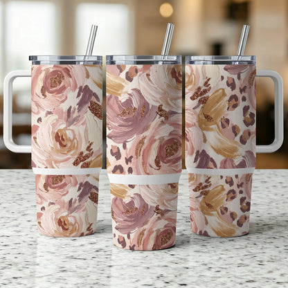 Three tumblers with a floral and leopard print design, each with a metal straw.