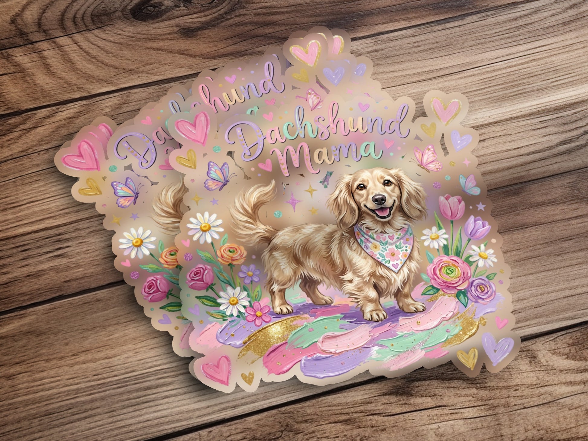 Dachshund mama sticker with flowers, hearts, and butterflies on wood background.