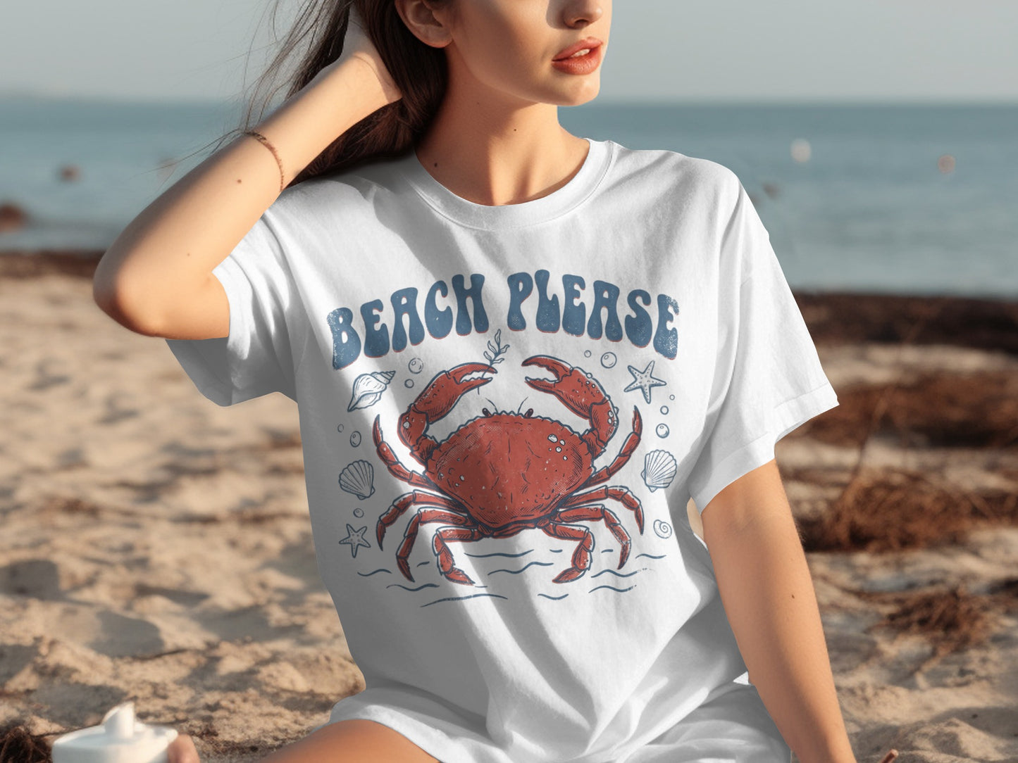 White t-shirt with a large red crab and "Beach Please" text.