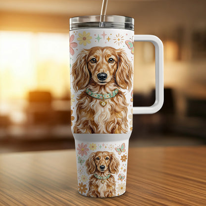 Dachshund pattern on a travel tumbler with straw and handle.