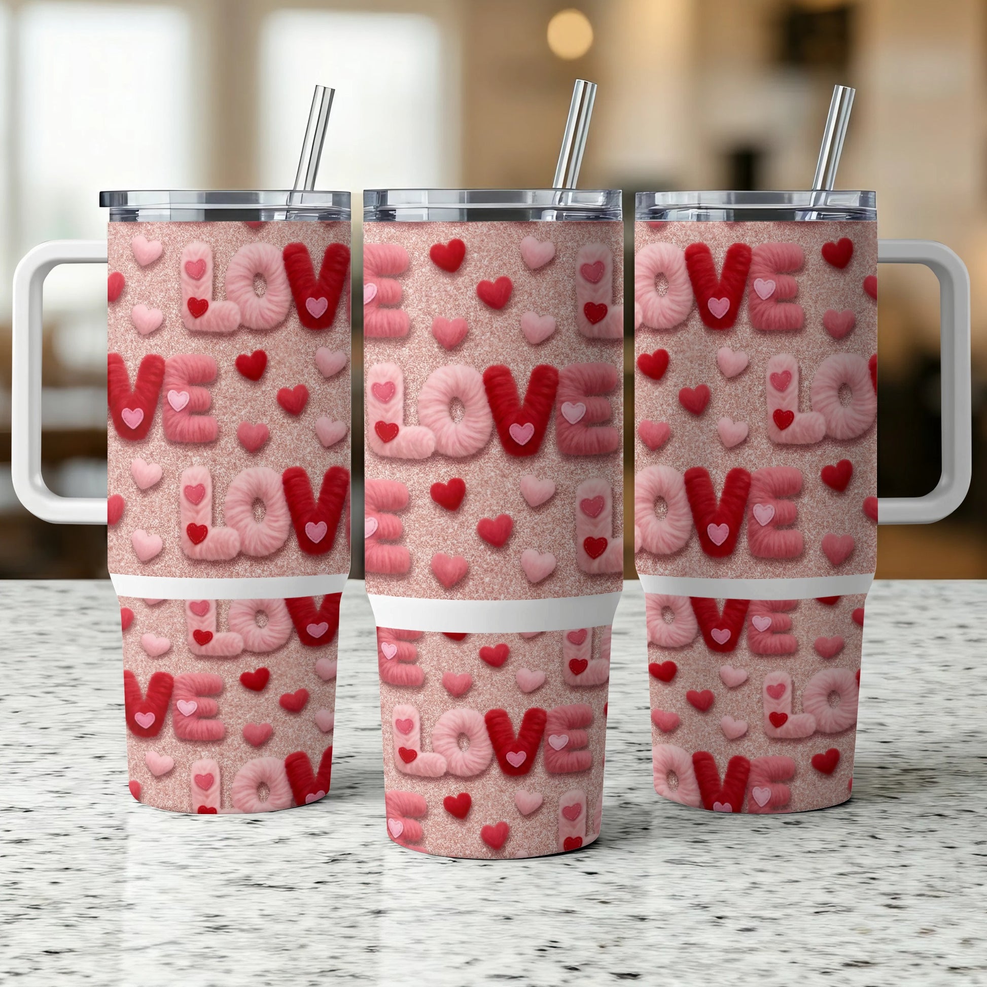 Three glitter tumblers with "LOVE" text and heart patterns.