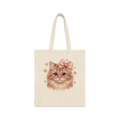 Tote bag with illustration of a fluffy cat wearing glasses and a pink bow.