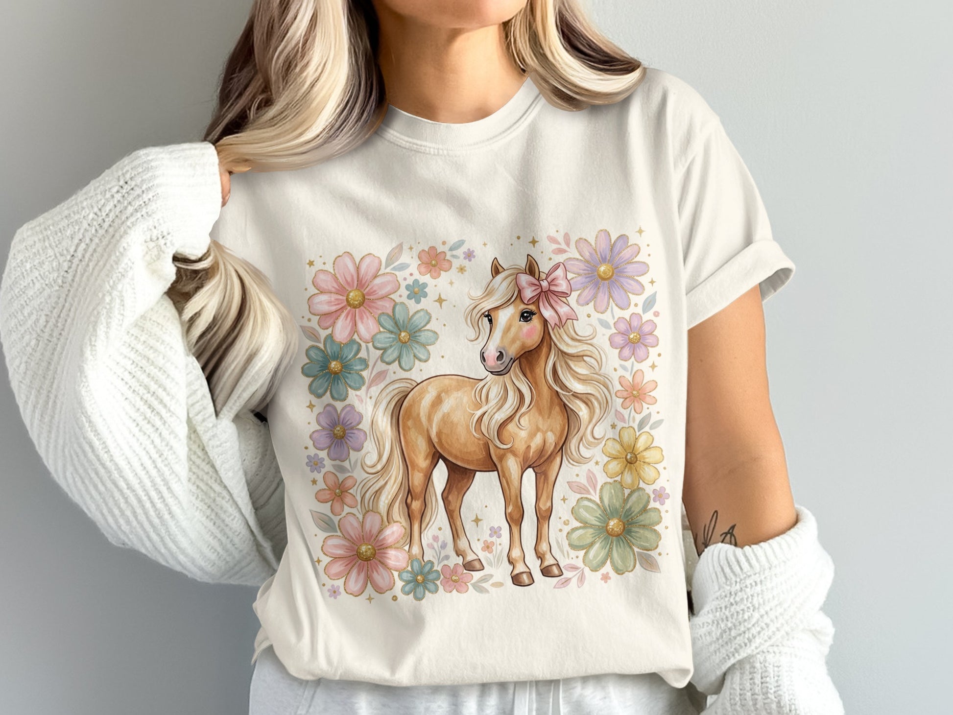 Light brown horse with pink bow surrounded by pastel flowers.