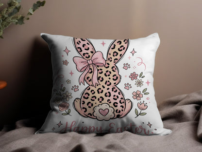 Pillow with pink leopard print bunny, bow, flowers, and "Happy Easter" text.