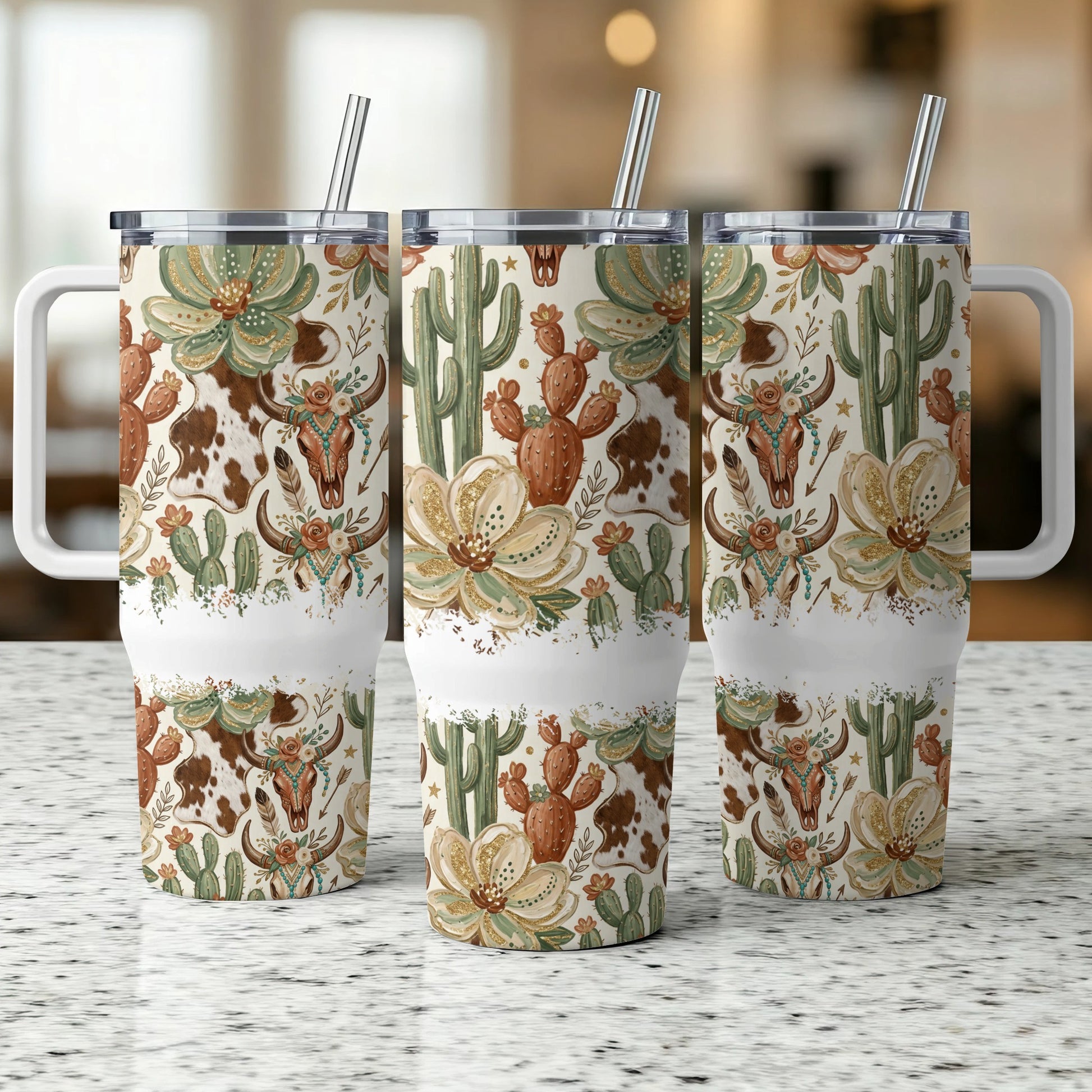 Three tumblers with cowhide, cactus, and floral designs.
