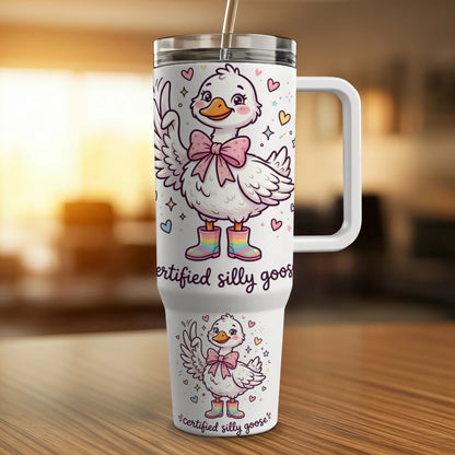 White tumbler with a cartoon goose wearing a pink bow and boots, text reads "certified silly goose".