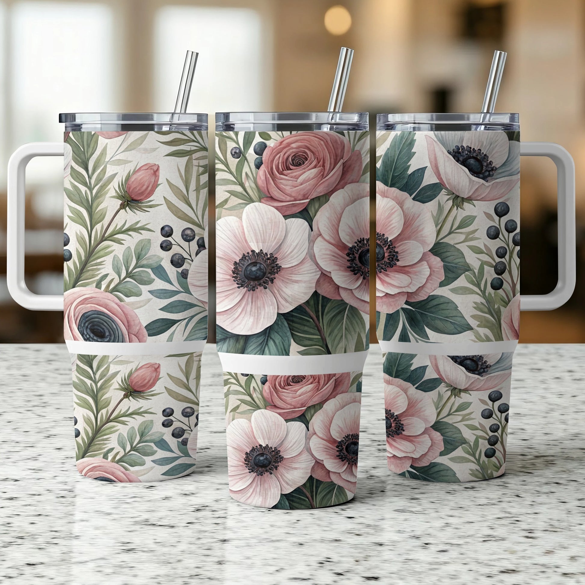 Three travel tumblers with a floral and berry pattern.