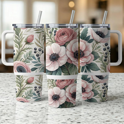 Three travel tumblers with a floral and berry pattern.