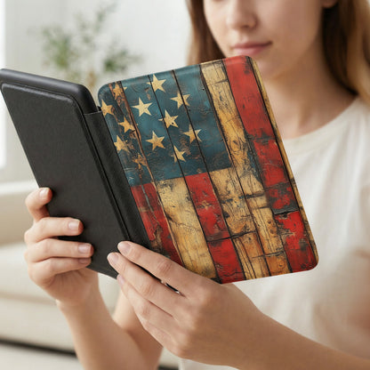 Person holding an e-reader with a distressed American flag case.
