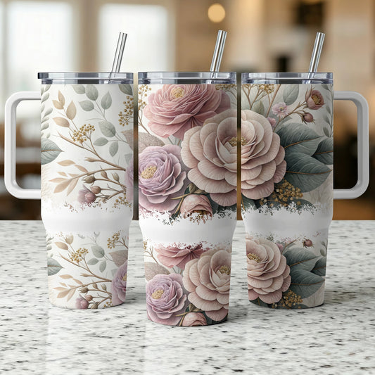 Three tumblers with floral designs and white handles.