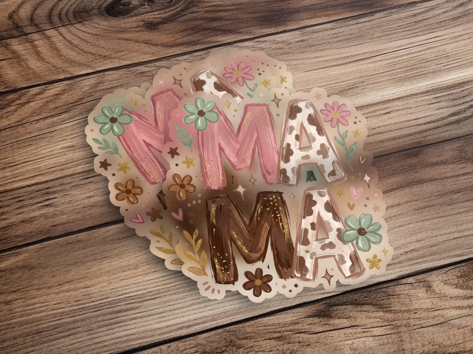 "Mama" word art stickers with floral accents on a wooden background.