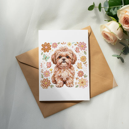 Card with a fluffy dog surrounded by floral and butterfly illustrations.