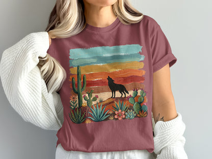 T-shirt featuring a silhouette of a howling wolf against a desert landscape.