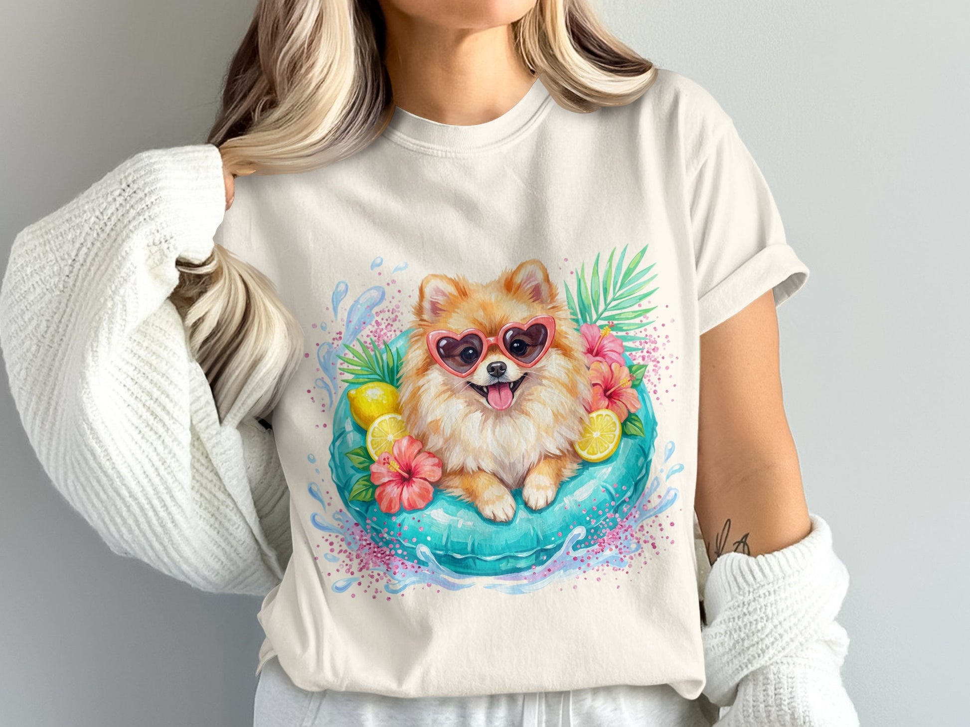 Pomeranian dog in sunglasses floats in a pool with flowers and lemons.