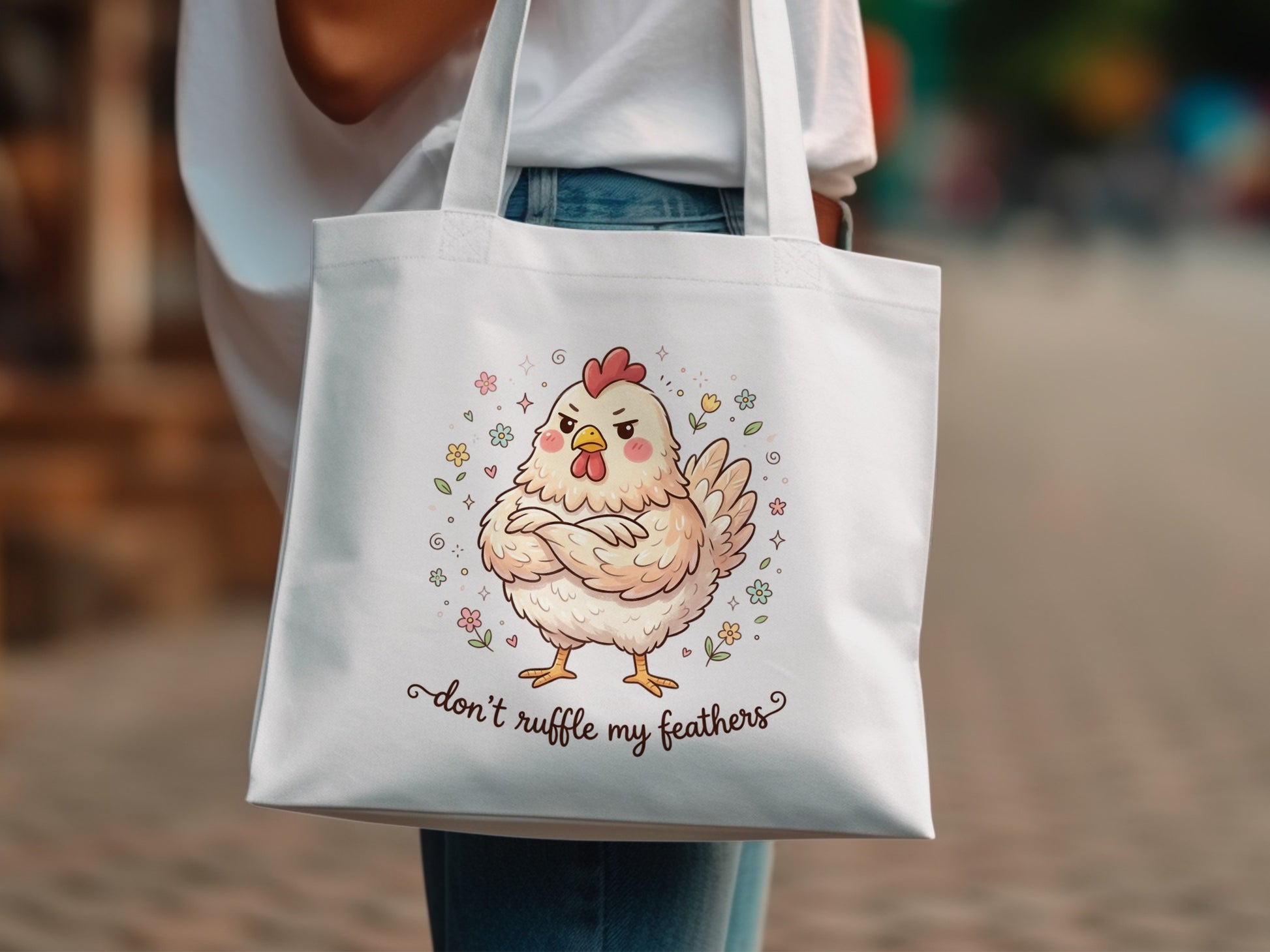 White tote bag with cartoon chicken and text "don't ruffle my feathers".