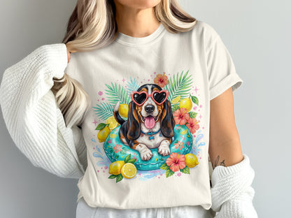 Basset hound wearing heart sunglasses in a pool float with lemons and flowers.
