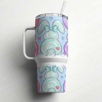 Easter bunny tumbler with pastel balloons and hearts on a white wooden background.