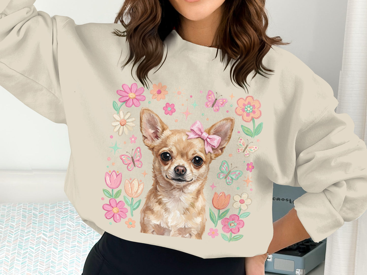 Chihuahua wearing pink bow surrounded by flowers and butterflies.