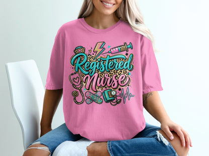 Pink t-shirt with "Registered Nurse" and medical icons in colorful distressed print.