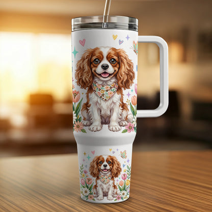 White tumbler with repeating Cavalier King Charles Spaniel pattern and floral accents.