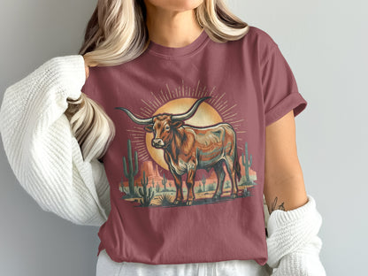 T-shirt featuring a longhorn steer against a desert sunset with cacti.