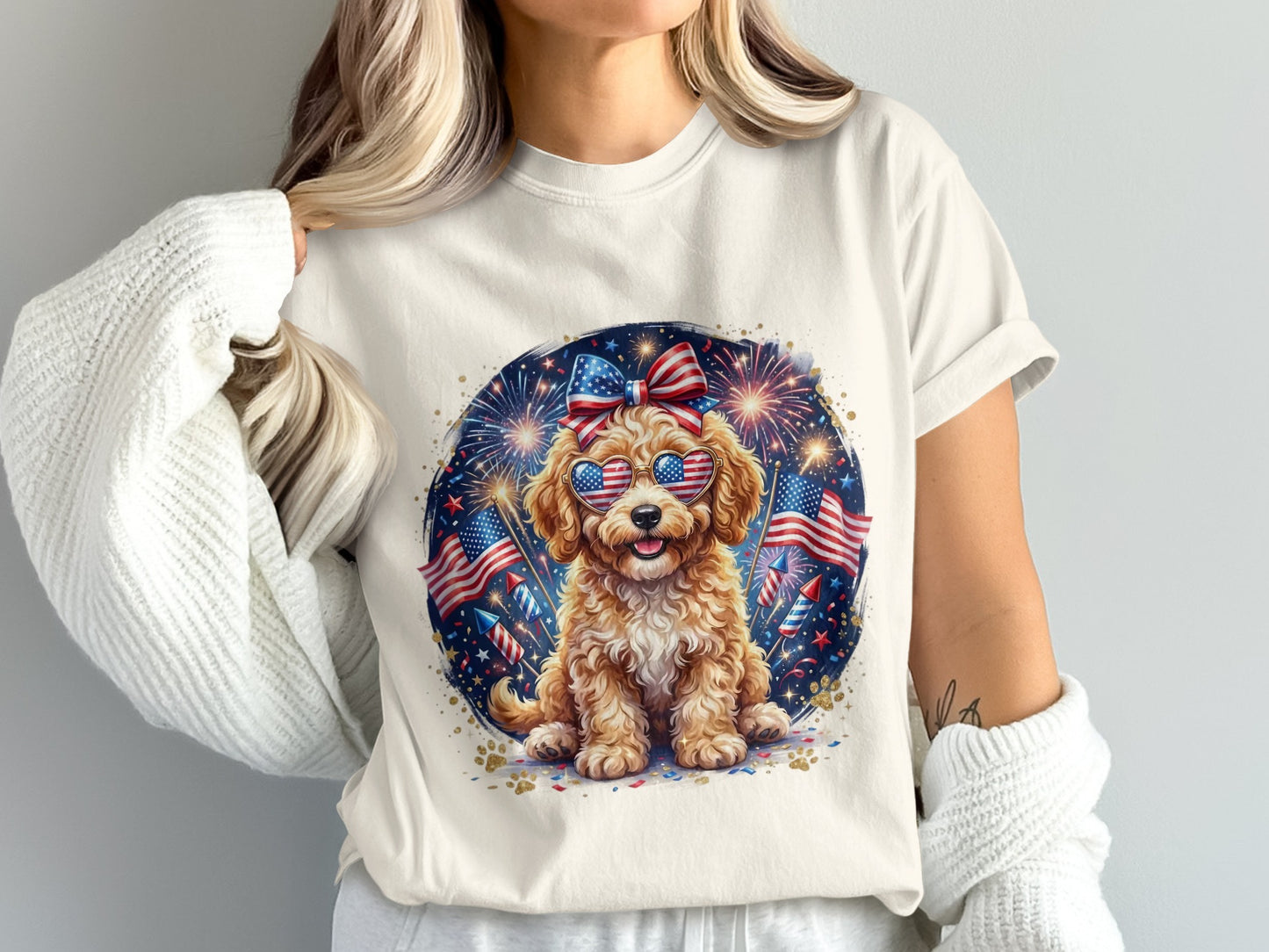 Golden doodle puppy wearing American flag sunglasses with fireworks.