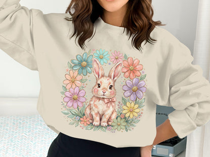 Crewneck sweatshirt with a floral wreath and a cartoon bunny.