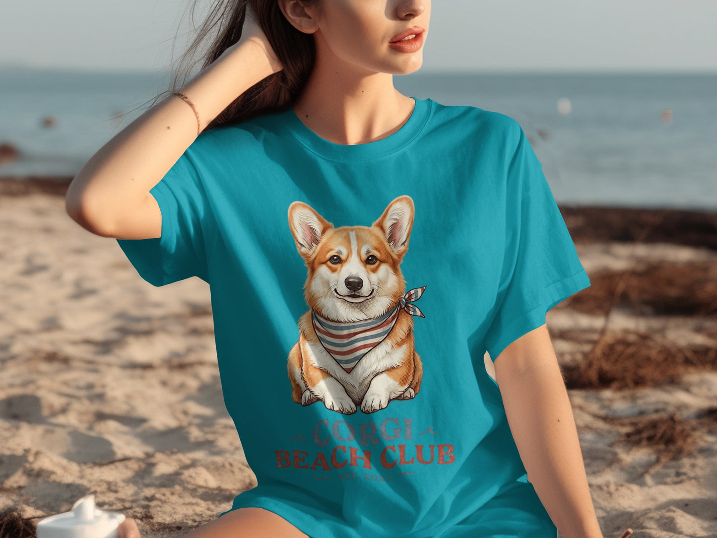 Corgi dog wearing bandana on teal t-shirt, "Corgi Beach Club" text.