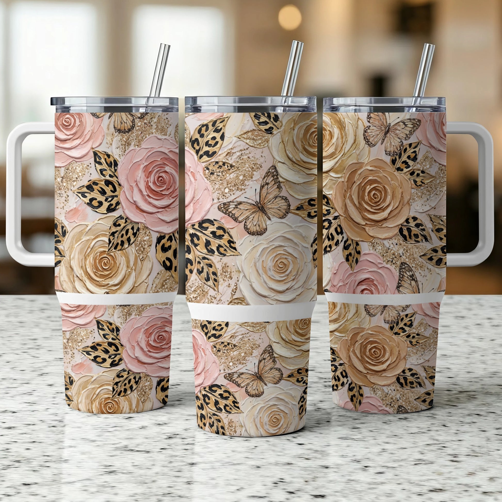 Three floral tumblers with handles, featuring roses, butterflies, and leopard print.