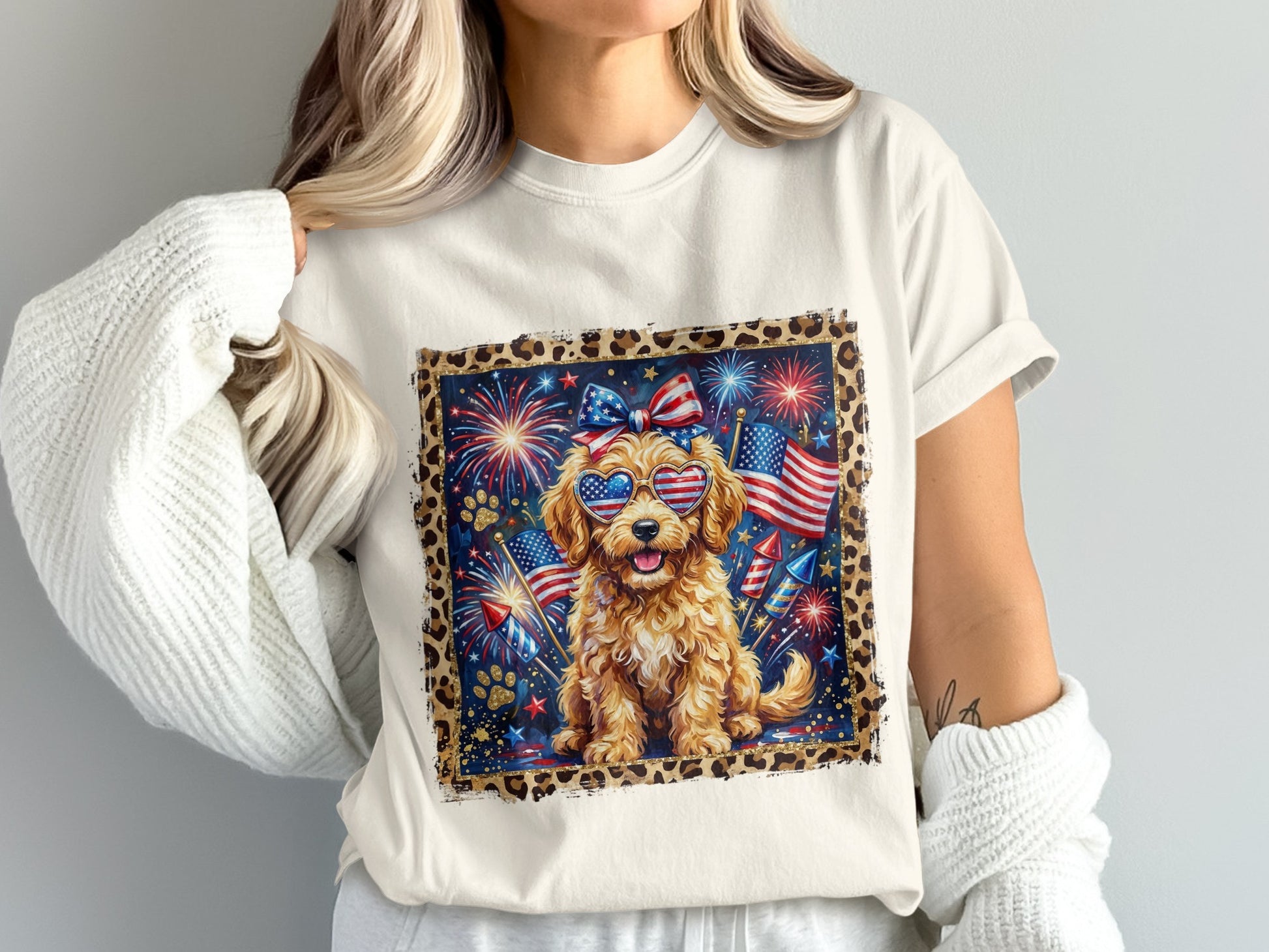 Goldendoodle dog wearing sunglasses with fireworks and American flags.