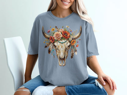 Boho bull skull with feathers and floral garland graphic on grey t-shirt.