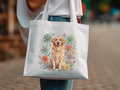 White tote bag with a watercolor golden retriever surrounded by pastel flowers.