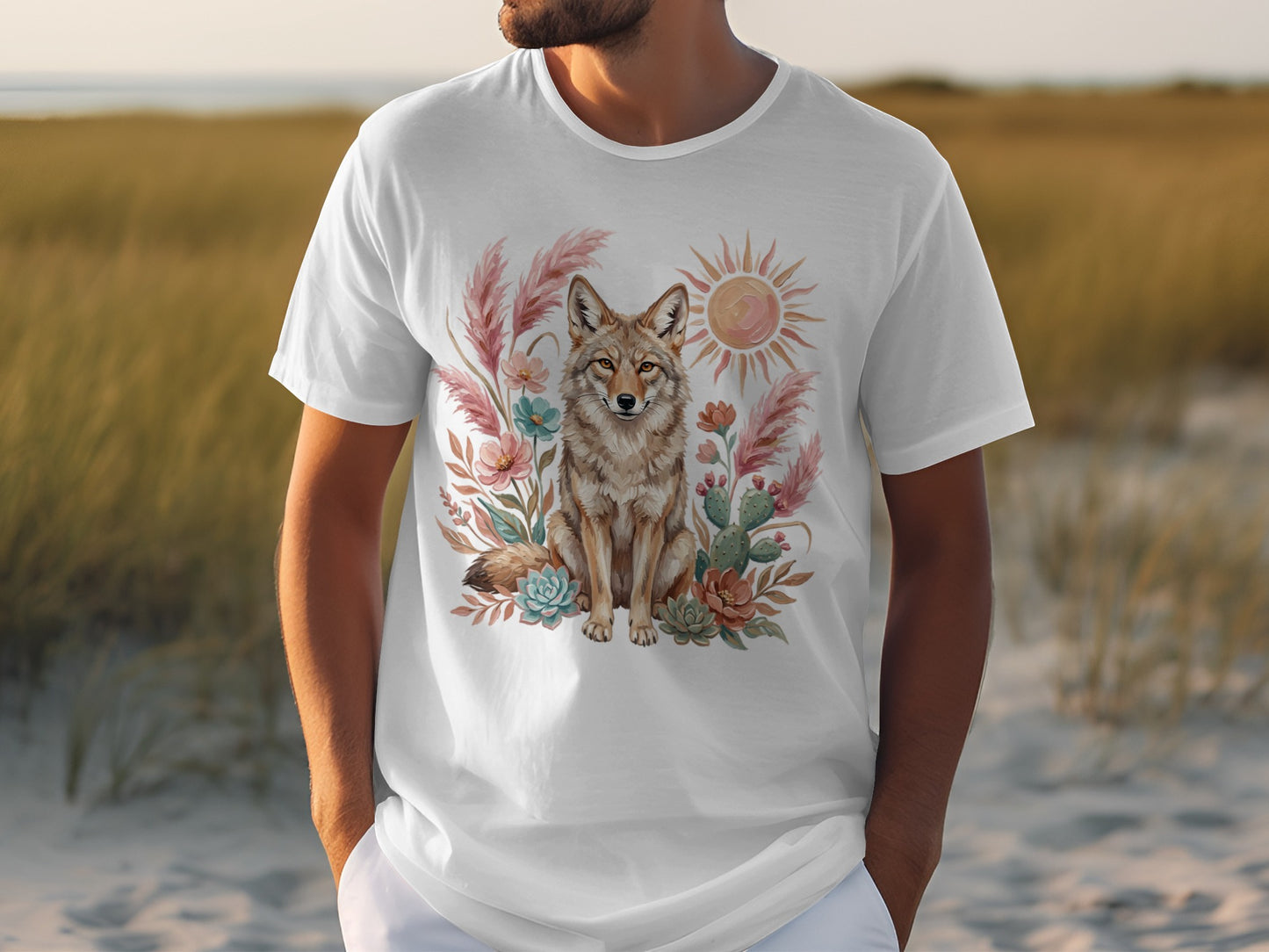 White t-shirt with a desert scene featuring a coyote, succulents, and sun.