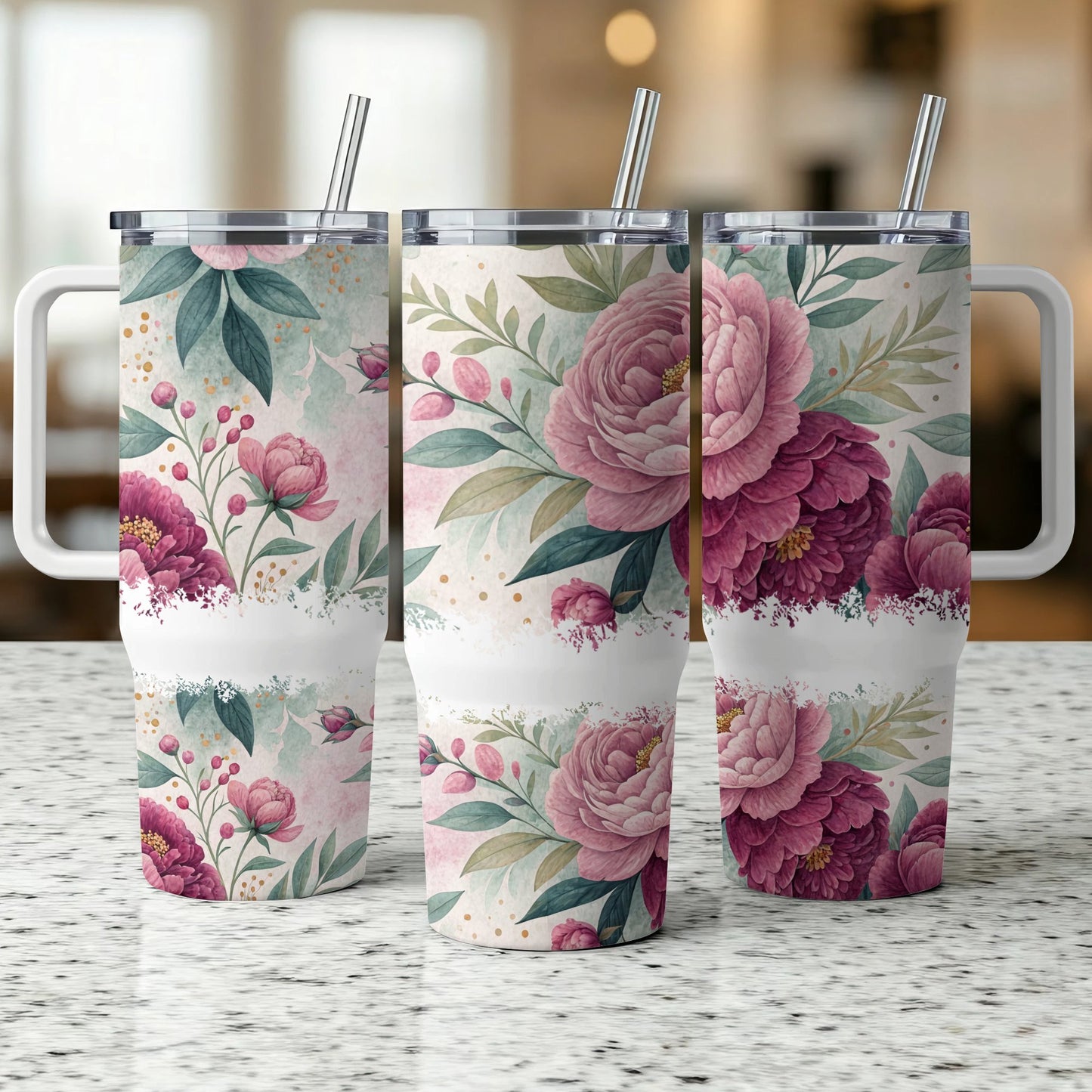 Three tumblers with pink floral patterns and reusable straws.