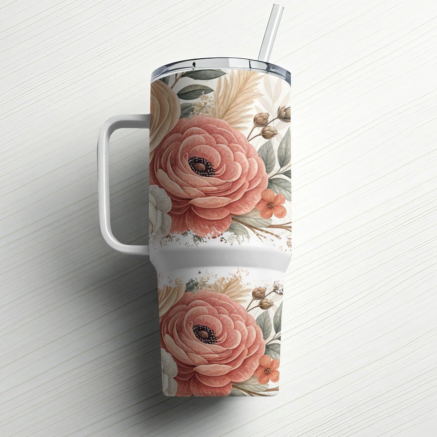 Floral tumbler with handle and straw, cream background with pink roses and greenery.