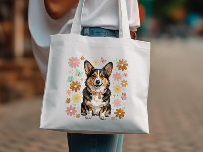 White tote bag with a corgi illustration and floral accents.
